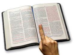 Pointing to a verse of assurance in her Bible