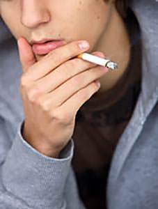 teen guy smoking a cigarette